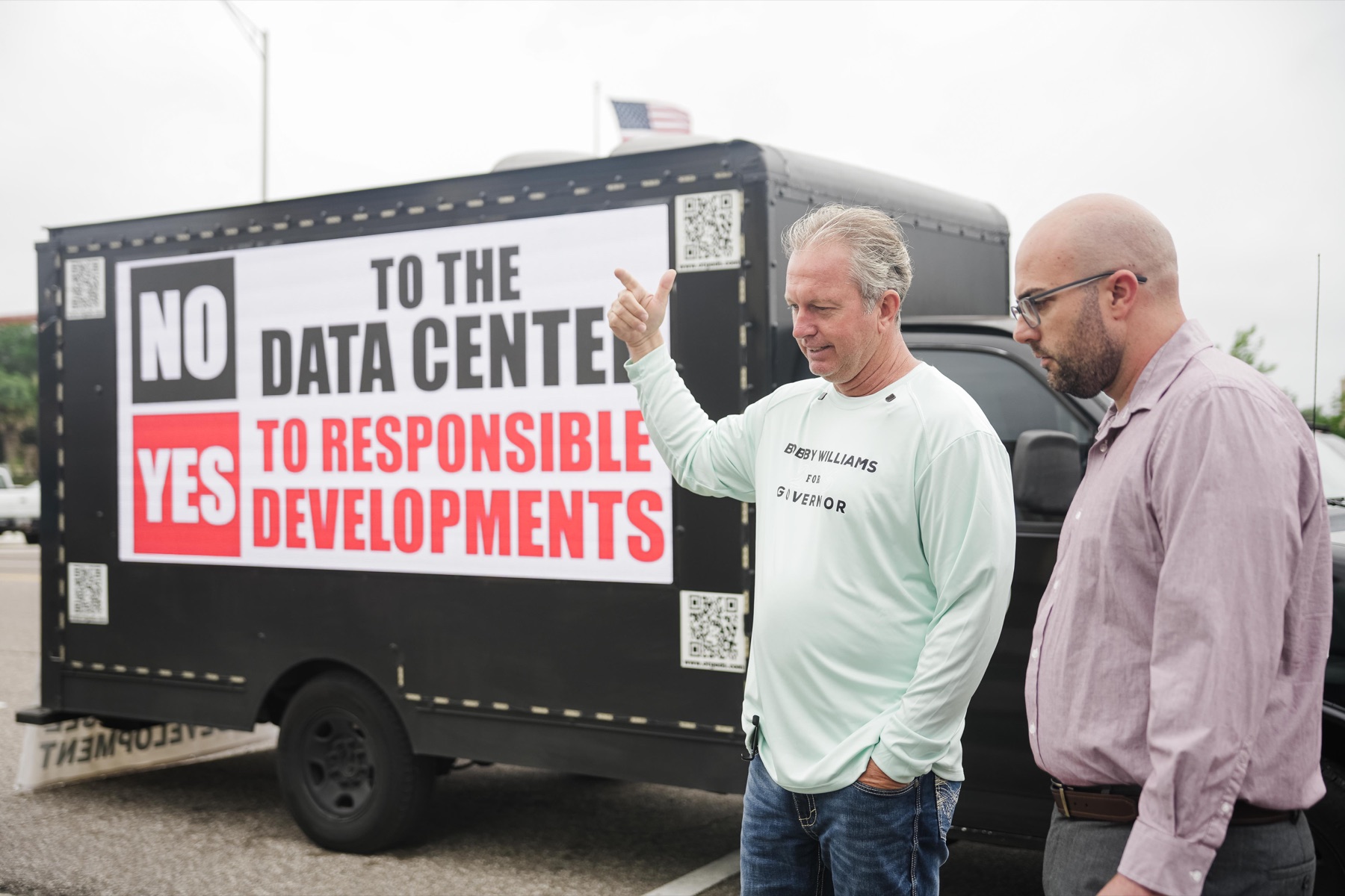 Bobby Williams near a responsible development message.